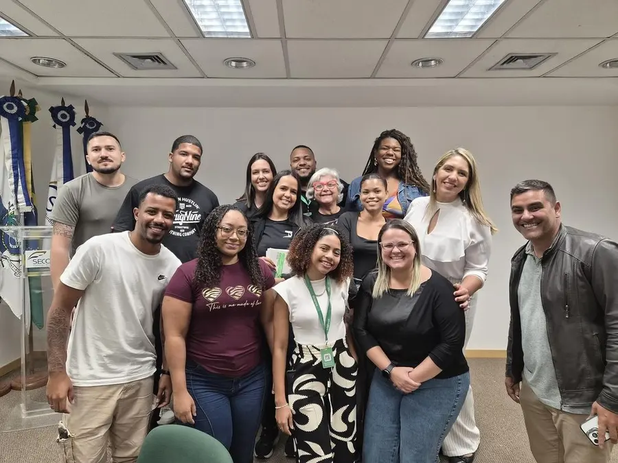 Colaboradores da Telmax reunidos em um workshop interno